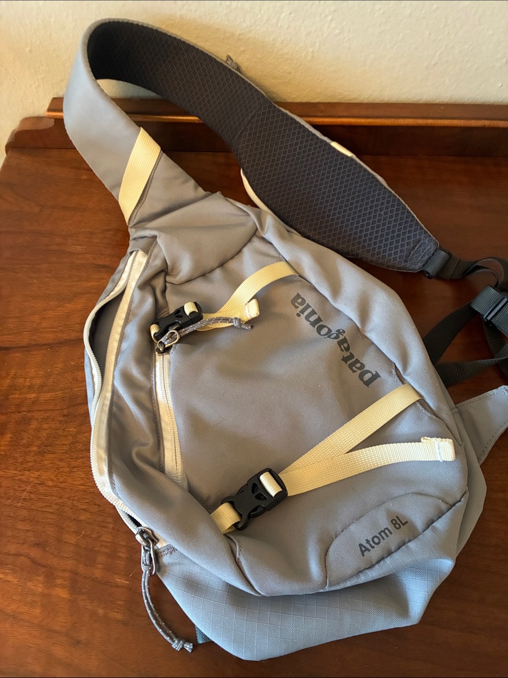 Patagonia Atom 8L Sling Bag in Light Gray with Cream Straps